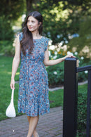 Floral Midi Dress with Smocked Waist and Ruffle Sleeves.